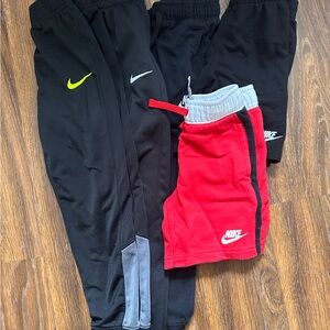 Lot of Nike pants and shorts